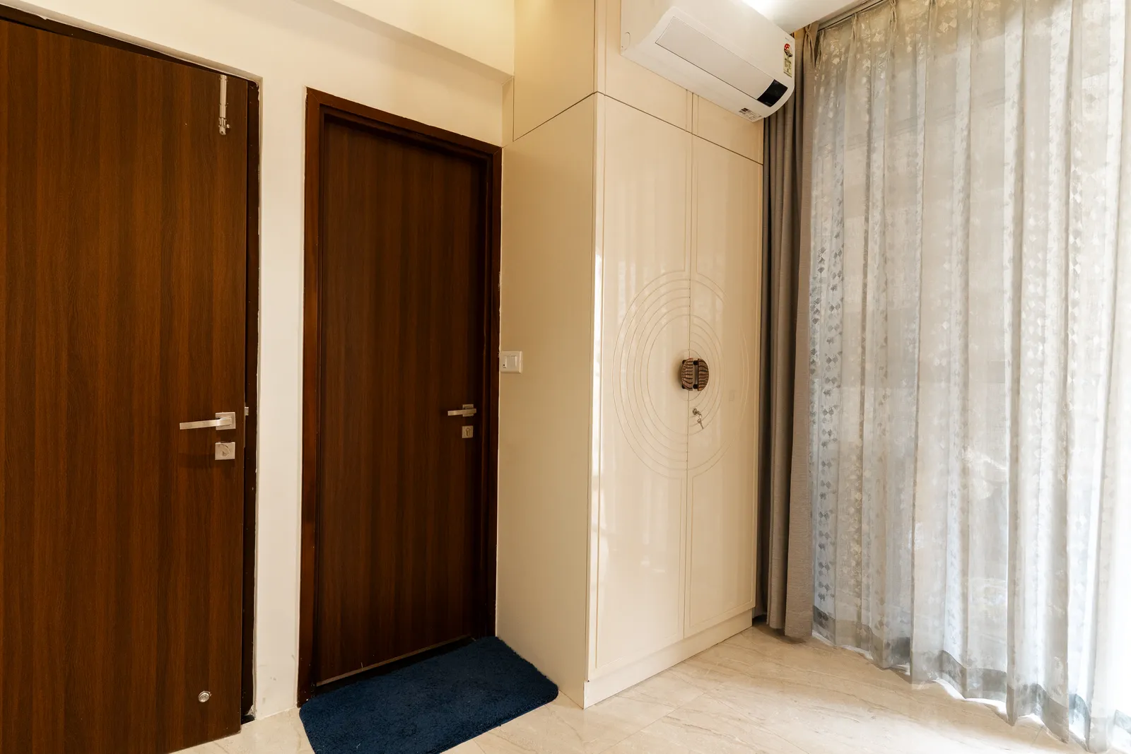 Entrance with walnut doors and white shoe cabinet — Arna's Home